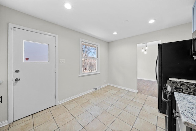 3508 Maple Ln, Hazel Crest, IL 60429 - kitchen featuring stainless steel range with gas cooktop, light countertops, recessed lighting, and light tile patterned floors