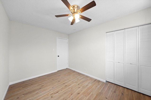 3508 Maple Ln, Hazel Crest, IL 60429 - unfurnished bedroom with light wood finished floors, a closet, and ceiling fan