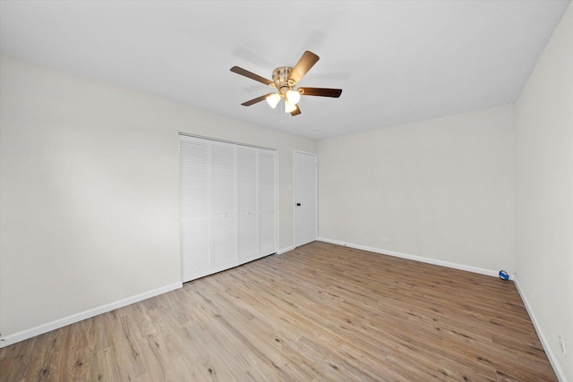 3508 Maple Ln, Hazel Crest, IL 60429 - unfurnished bedroom featuring wood finished floors, a closet, and a ceiling fan