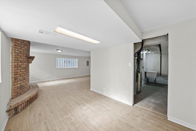 3508 Maple Ln, Hazel Crest, IL 60429 - unfurnished living room with light wood finished floors and baseboards