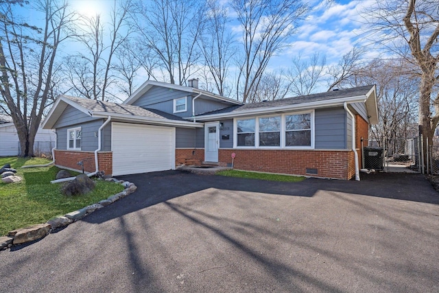 3508 Maple Ln, Hazel Crest, IL 60429 - tri-level home with brick siding, driveway, and a garage