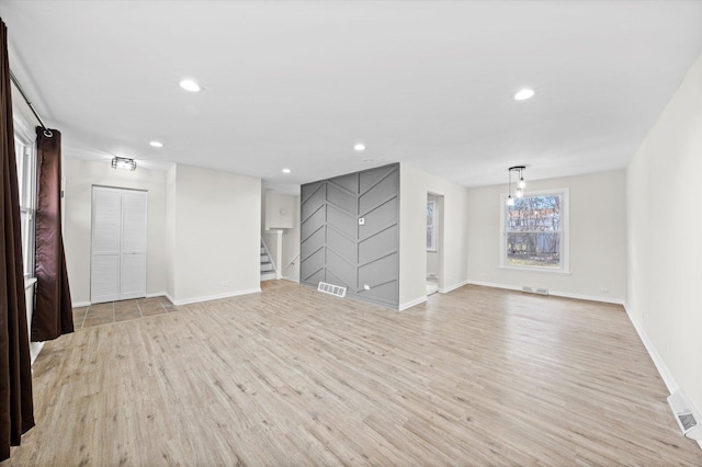 3508 Maple Ln, Hazel Crest, IL 60429 - unfurnished living room with light wood-type flooring, stairway, and recessed lighting