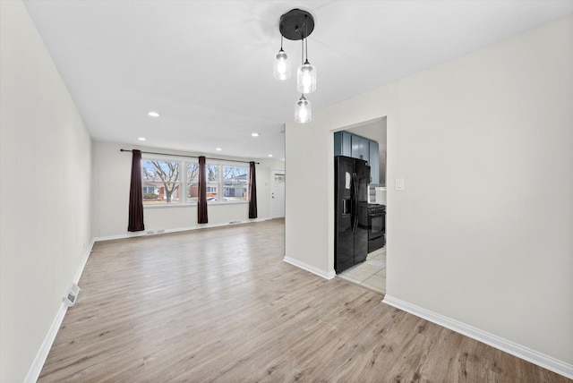3508 Maple Ln, Hazel Crest, IL 60429 - unfurnished living room with light wood-style flooring and recessed lighting