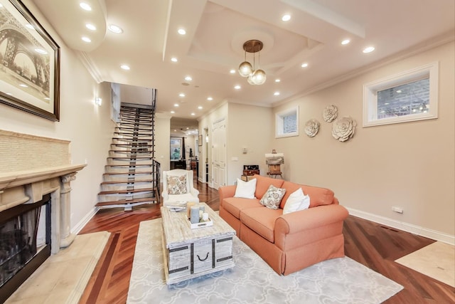 2011 W Huron St, Chicago, IL 60612 - living room with a premium fireplace, wood finished floors, ornamental molding, stairway, and recessed lighting