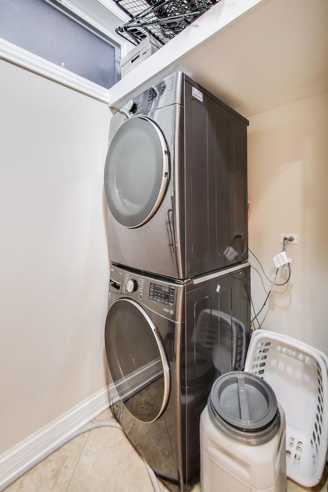 2011 W Huron St, Chicago, IL 60612 - washroom with stacked washer / dryer and tile patterned floors