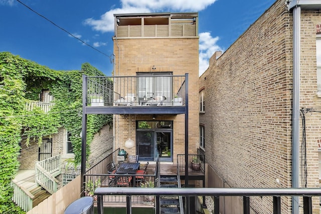 2011 W Huron St, Chicago, IL 60612 - rear view of property featuring a balcony and brick siding