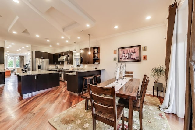 2011 W Huron St, Chicago, IL 60612 - dining room with crown molding and light wood-style flooring