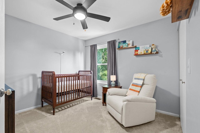 10154 Ashley St, Huntley, IL 60142 - carpeted bedroom with a crib and ceiling fan