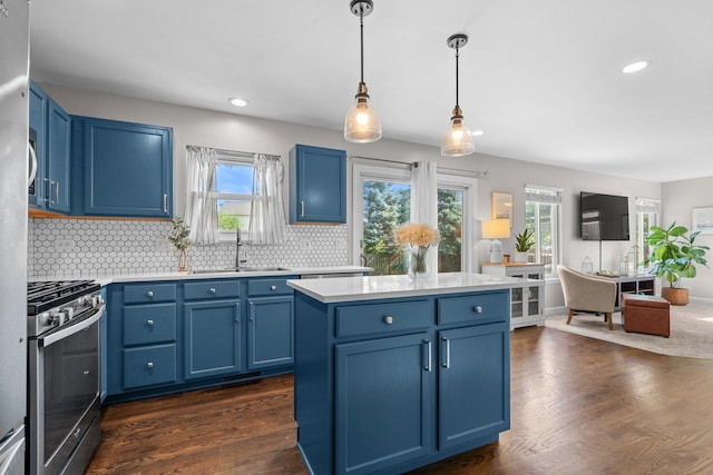 10154 Ashley St, Huntley, IL 60142 - kitchen featuring blue cabinets, stainless steel gas range, plenty of natural light, light countertops, and recessed lighting