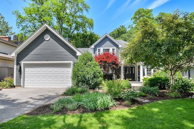 72 Gray St, Saint Charles, IL 60174 - view of front of property featuring asphalt driveway, a garage, and a front yard