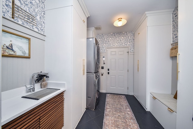 72 Gray St, Saint Charles, IL 60174 - washroom with stacked washing machine and dryer and dark tile patterned flooring