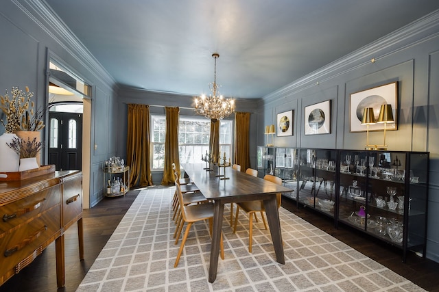 72 Gray St, Saint Charles, IL 60174 - dining area featuring a chandelier, ornamental molding, a decorative wall, and wood finished floors