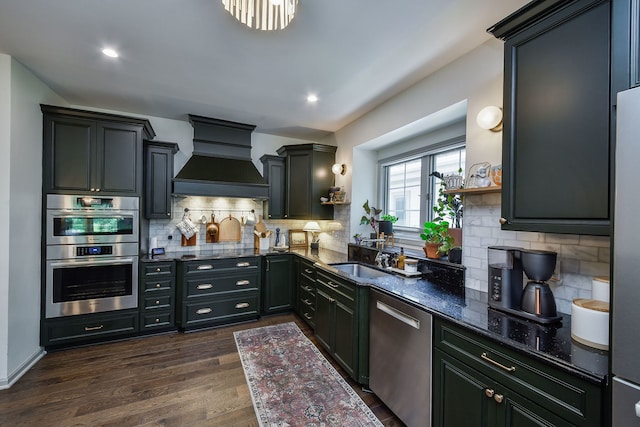 72 Gray St, Saint Charles, IL 60174 - kitchen featuring appliances with stainless steel finishes, premium range hood, dark wood-type flooring, tasteful backsplash, and dark stone countertops