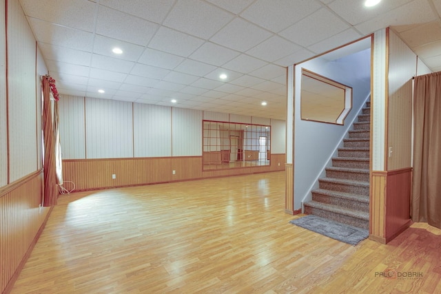 2208 Sanctuary Ct, Gurnee, IL 60031 - spare room with wood finished floors, stairway, wainscoting, wood walls, and a drop ceiling