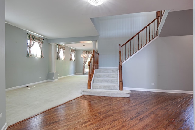 2208 Sanctuary Ct, Gurnee, IL 60031 - entryway with decorative columns, stairway, a chandelier, and wood finished floors