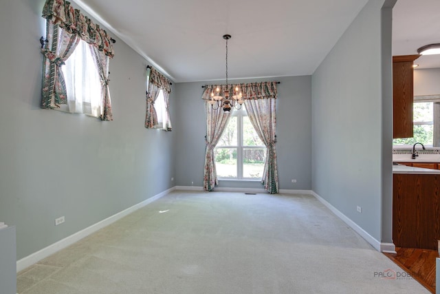 2208 Sanctuary Ct, Gurnee, IL 60031 - unfurnished dining area featuring light carpet and a chandelier
