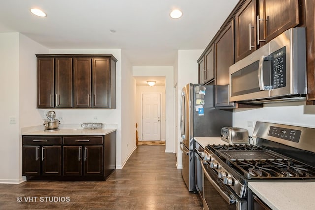 16212 W Switch Grass Rd, Lockport, IL 60441 - kitchen featuring stainless steel appliances, dark wood-type flooring, dark brown cabinetry, recessed lighting, and light stone countertops