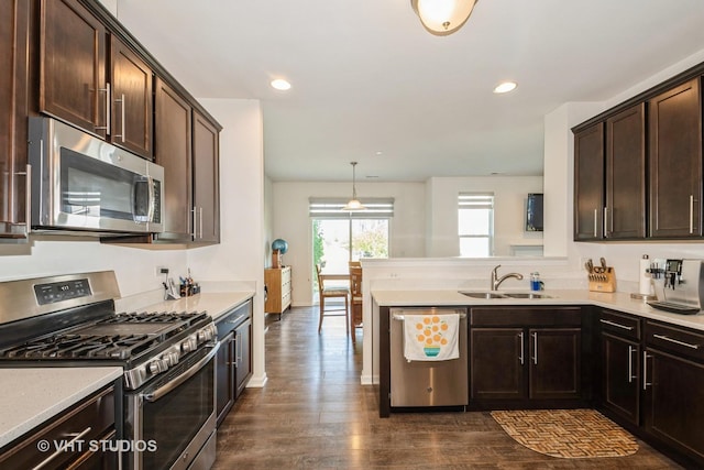 16212 W Switch Grass Rd, Lockport, IL 60441 - kitchen with appliances with stainless steel finishes, dark brown cabinetry, dark wood-style floors, light countertops, and recessed lighting