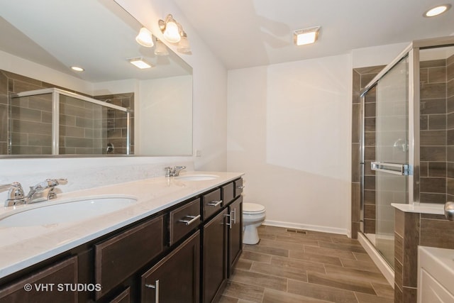 16212 W Switch Grass Rd, Lockport, IL 60441 - bathroom featuring double vanity, a shower stall, and recessed lighting