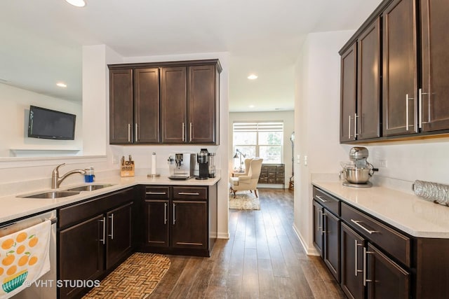 16212 W Switch Grass Rd, Lockport, IL 60441 - kitchen with stainless steel dishwasher, dark brown cabinets, dark wood-style flooring, light countertops, and recessed lighting