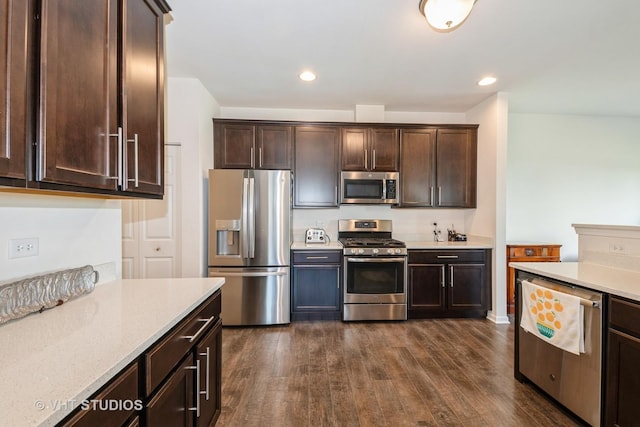 16212 W Switch Grass Rd, Lockport, IL 60441 - kitchen featuring stainless steel appliances, dark wood finished floors, dark brown cabinetry, recessed lighting, and light stone counters