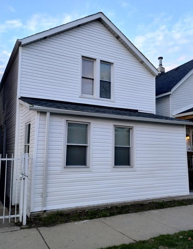 4936 W Harrison St, Chicago, IL 60644 - view of property exterior featuring roof with shingles