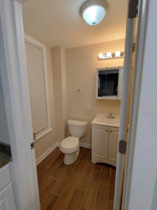 4936 W Harrison St, Chicago, IL 60644 - bathroom with vanity and wood finish floors