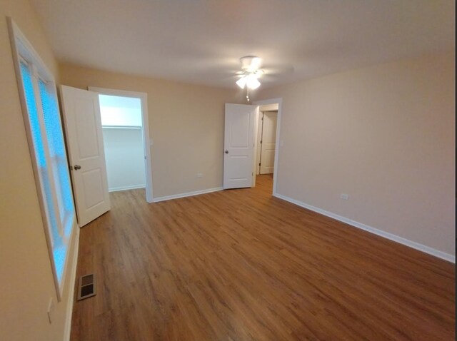 4936 W Harrison St, Chicago, IL 60644 - spare room featuring wood finished floors and ceiling fan
