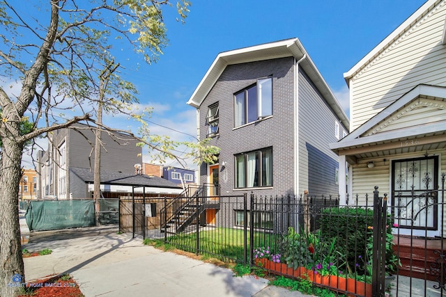 1538 W 21st St Unit 1, Chicago, IL 60608 - view of side of property featuring a fenced front yard, a porch, and a gate