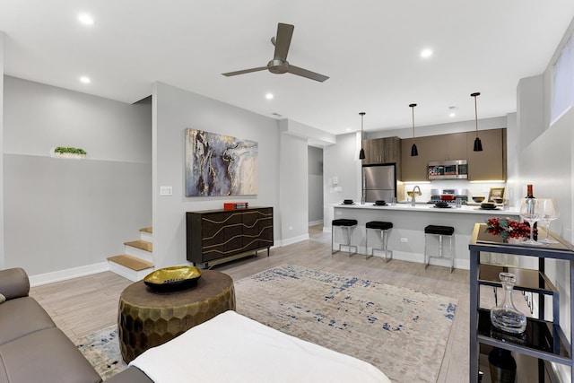 1538 W 21st St Unit 1, Chicago, IL 60608 - living room featuring ceiling fan, recessed lighting, light wood-style flooring, and stairs