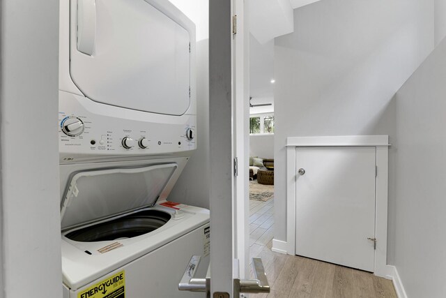 1538 W 21st St Unit 1, Chicago, IL 60608 - laundry room featuring stacked washer / dryer and light wood-type flooring