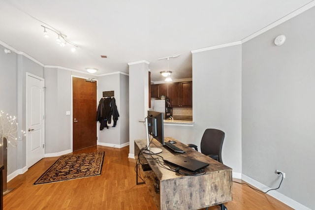 420 E Waterside Dr Unit 1302, Chicago, IL 60601 - office with light wood-type flooring, ornamental molding, and track lighting