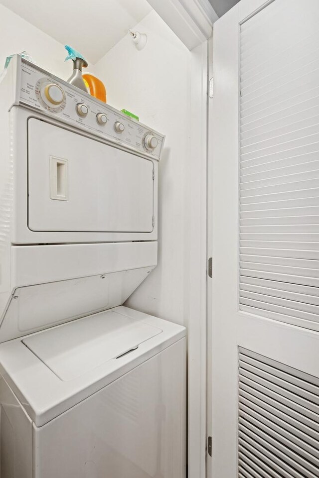 420 E Waterside Dr Unit 1302, Chicago, IL 60601 - washroom featuring stacked washer / drying machine