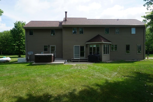 4914 W State Route 113, Kankakee, IL 60901 - back of house with a hot tub, a patio area, a yard, and entry steps