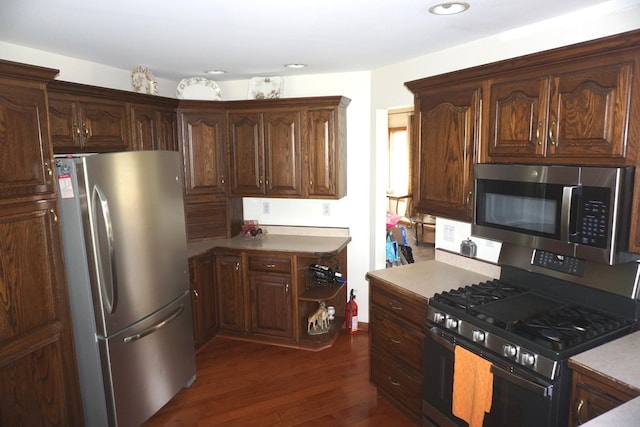 4914 W State Route 113, Kankakee, IL 60901 - kitchen with appliances with stainless steel finishes, dark wood-style floors, light countertops, recessed lighting, and dark brown cabinetry