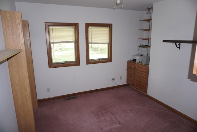 4914 W State Route 113, Kankakee, IL 60901 - unfurnished bedroom featuring dark carpet and baseboards