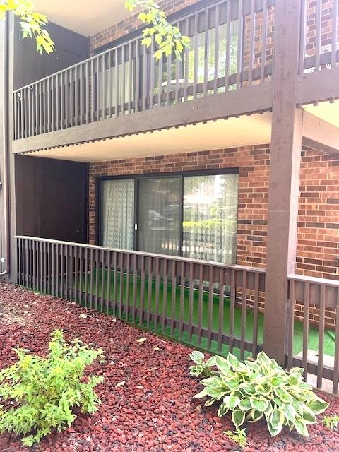 9550 Mason Ave Unit 2, Oak Lawn, IL 60453 - view of side of home with brick siding and a balcony