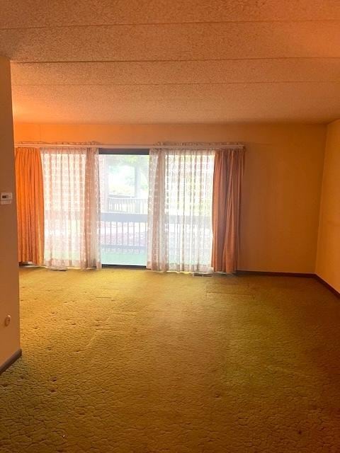 9550 Mason Ave Unit 2, Oak Lawn, IL 60453 - carpeted empty room with baseboards and a textured ceiling