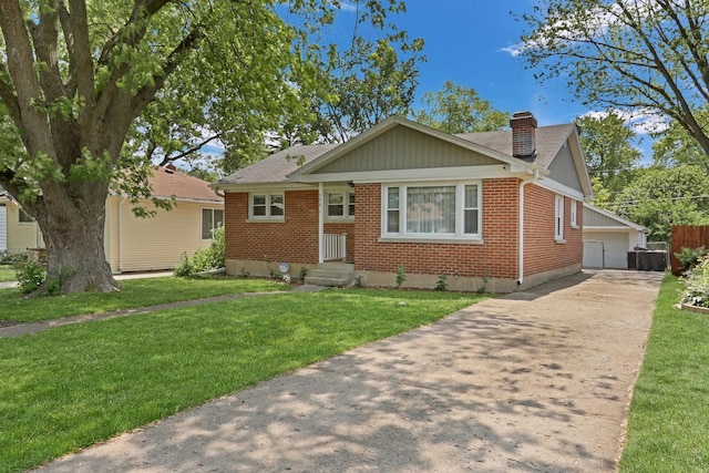 308 Dalton Ave, Mundelein, IL 60060 - bungalow-style home with brick siding, a chimney, a front yard, and roof with shingles