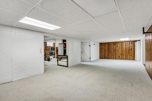 308 Dalton Ave, Mundelein, IL 60060 - below grade area featuring a drop ceiling, carpet flooring, wood walls, and brick wall