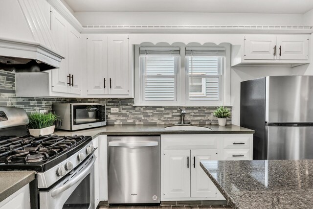 308 Dalton Ave, Mundelein, IL 60060 - kitchen with appliances with stainless steel finishes, custom range hood, white cabinetry, and tasteful backsplash