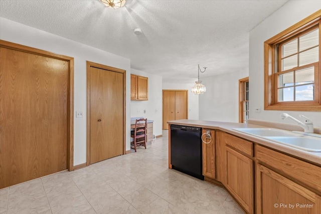 31-58 Wakonda Dr, Lake Carroll, IL 61046 - kitchen featuring black dishwasher, a chandelier, light countertops, brown cabinetry, and a textured ceiling