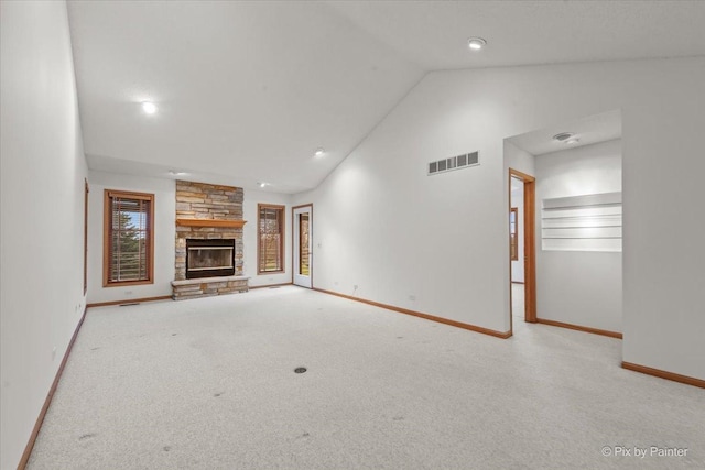 31-58 Wakonda Dr, Lake Carroll, IL 61046 - unfurnished living room featuring vaulted ceiling, carpet floors, and a stone fireplace