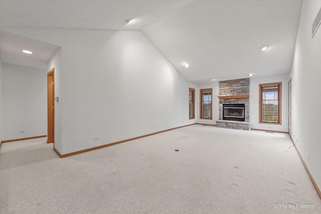 31-58 Wakonda Dr, Lake Carroll, IL 61046 - unfurnished living room with vaulted ceiling, carpet, a stone fireplace, and recessed lighting