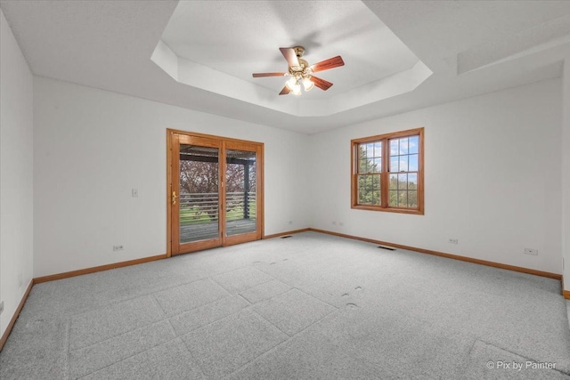 31-58 Wakonda Dr, Lake Carroll, IL 61046 - carpeted empty room featuring a tray ceiling and a ceiling fan