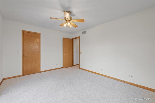 31-58 Wakonda Dr, Lake Carroll, IL 61046 - unfurnished bedroom featuring light colored carpet and ceiling fan