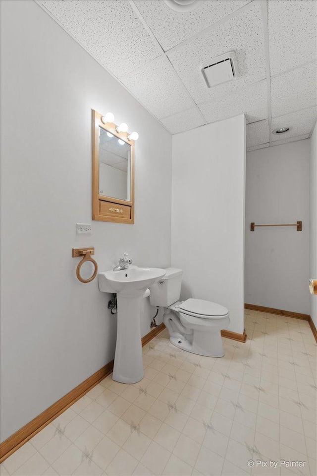 31-58 Wakonda Dr, Lake Carroll, IL 61046 - half bath featuring a drop ceiling and toilet