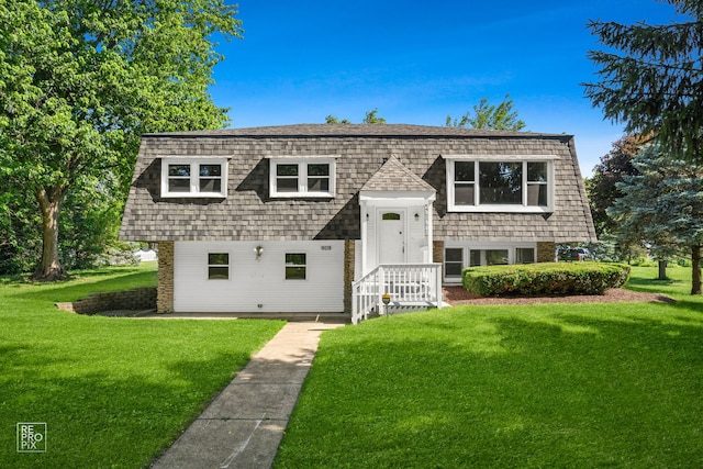 19228 W Quail Ct, Elwood, IL 60421 - raised ranch featuring a front yard, brick siding, and mansard roof