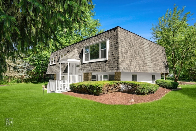 19228 W Quail Ct, Elwood, IL 60421 - view of home's exterior featuring a lawn and a shingled roof