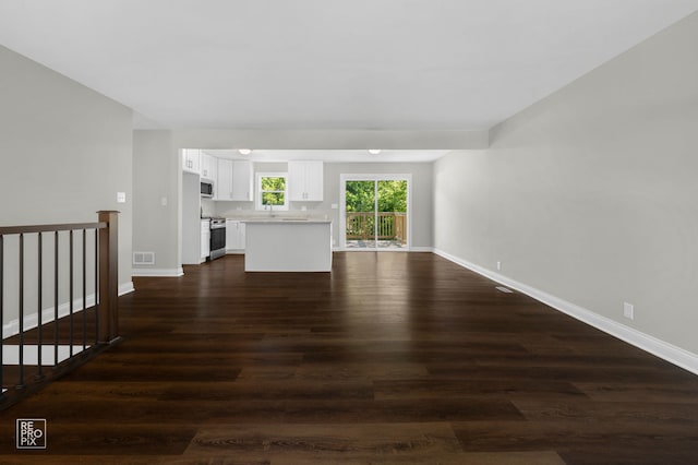19228 W Quail Ct, Elwood, IL 60421 - unfurnished living room featuring dark wood finished floors